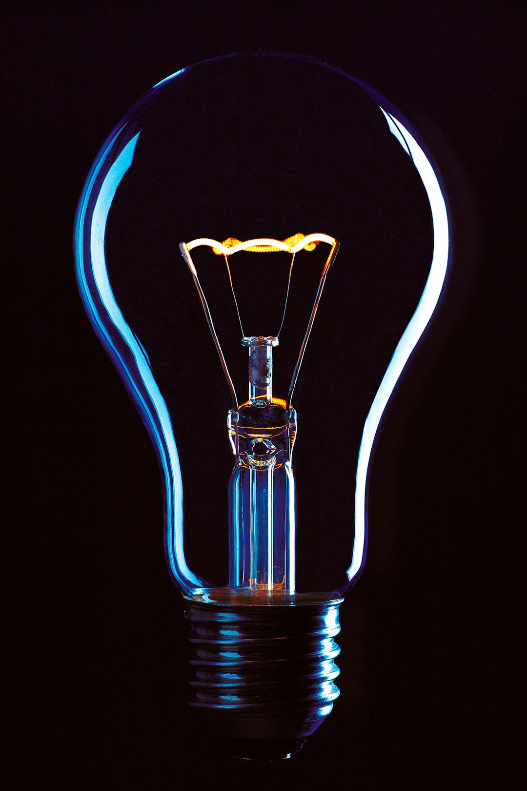 Services light bulb on black background